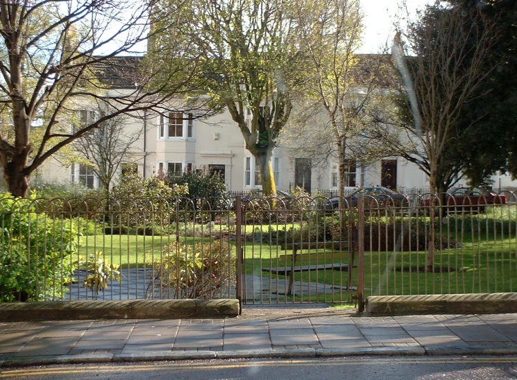 a house is shown with trees in front of it