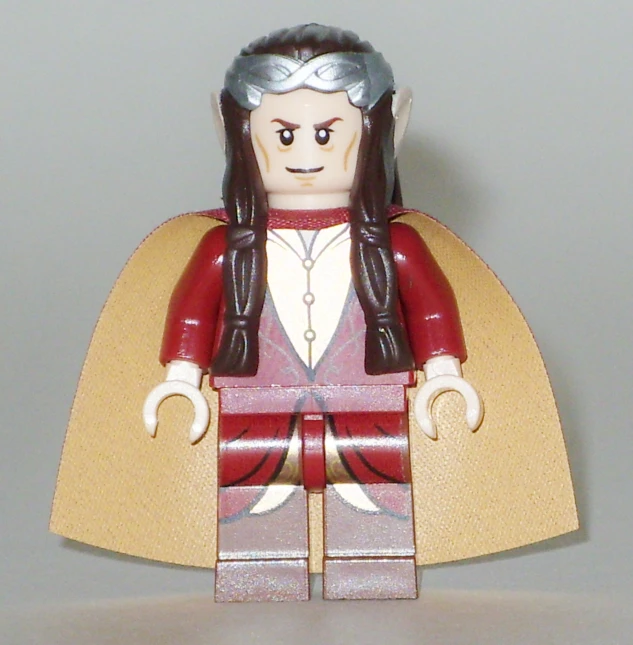 a lego man with a red cape and silver hair