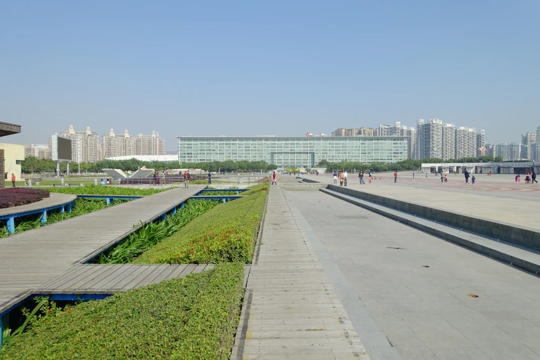 a row of benches at the edge of a walkway