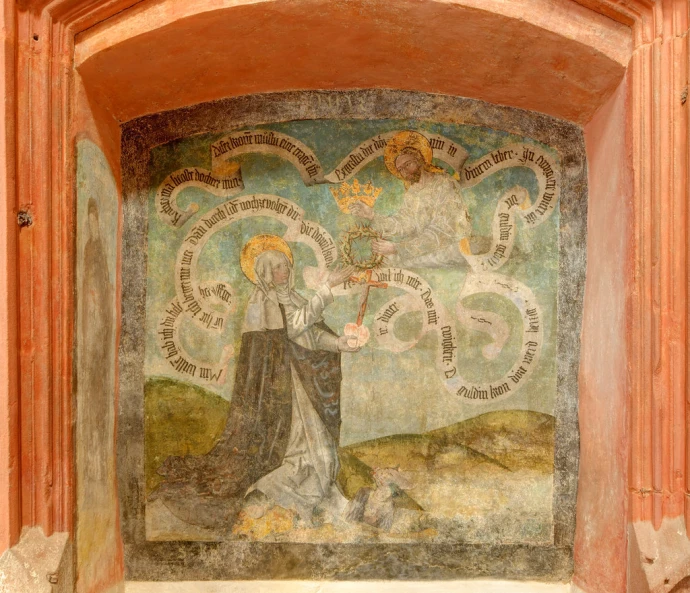 the painting is depicting the virgin on the wall