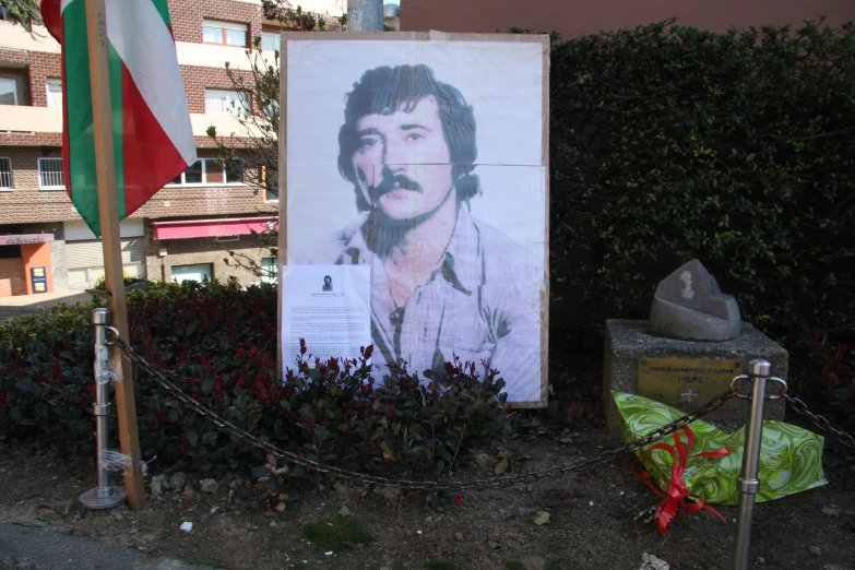 a poster is placed on the wall near a flag