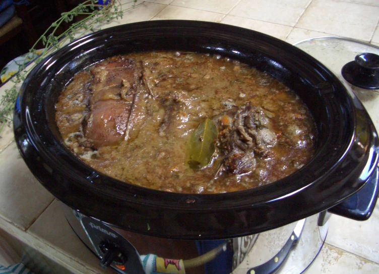 a close up of a cooked food in a crock pot