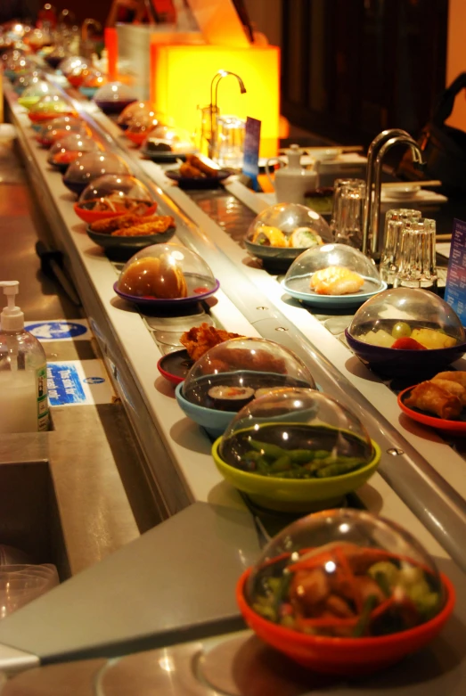 a long buffet table with different types of foods on it