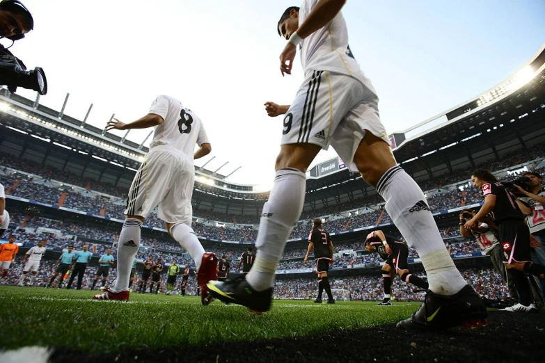 two soccer players on the field during a match