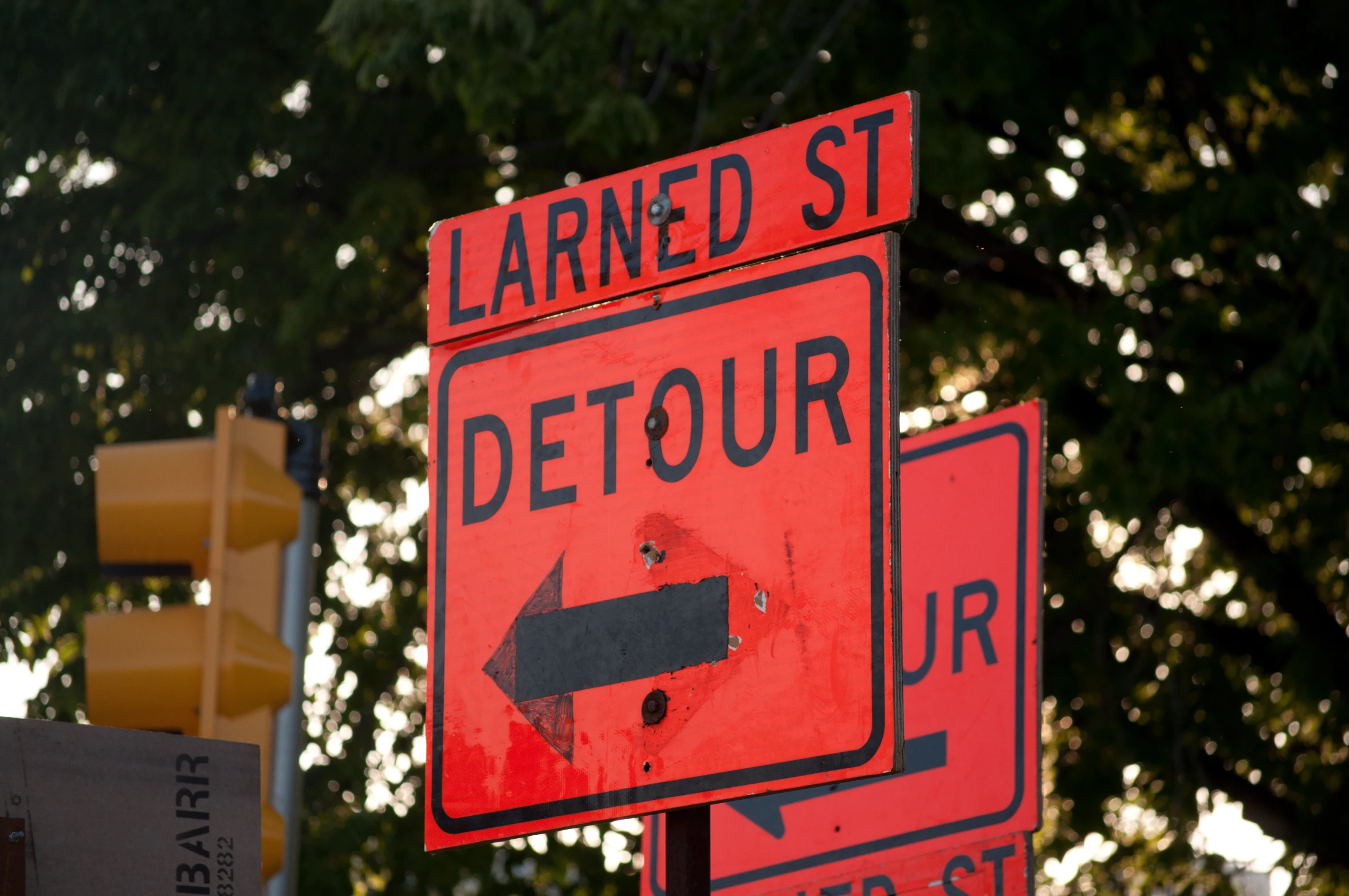 a large set of street signs on top of each other