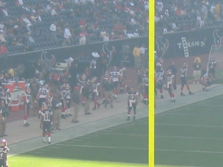 a football player throwing a ball on the field