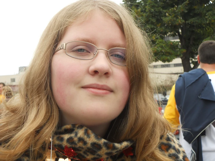 a close up image of a woman wearing glasses