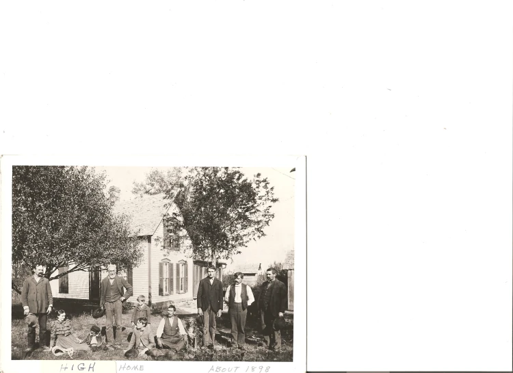 an old po of a group of men standing in front of a white house