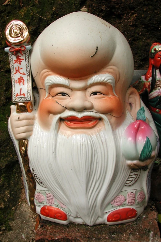 a close up of a statue with a knife
