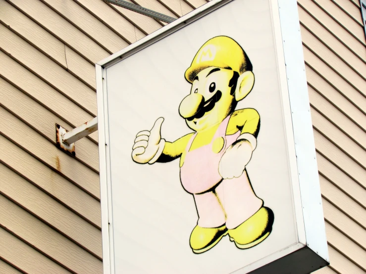 a large super mario brothers cartoon is on a building