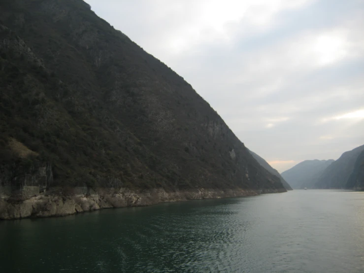 a scenic view of mountains that appear to be  through water