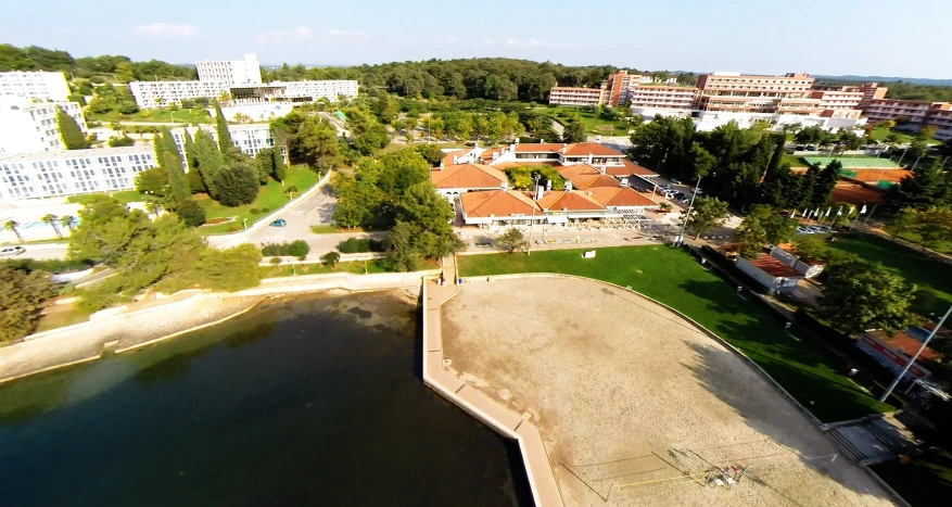 an aerial view of buildings along a river