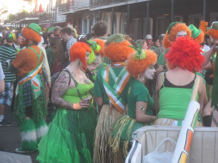 people in green and orange costumes and costumes