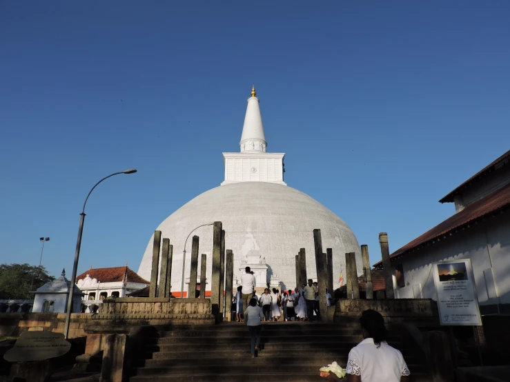 a large white building with a cross on top of it