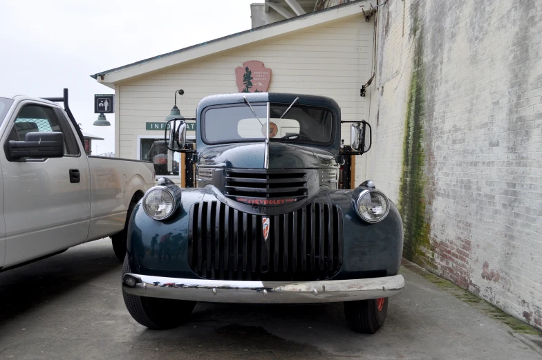 a pick up truck parked next to another pickup truck