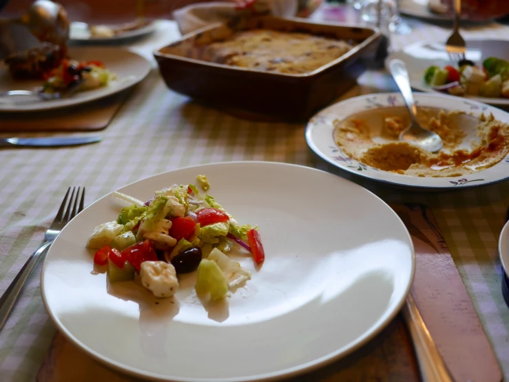 a white plate topped with food on a table