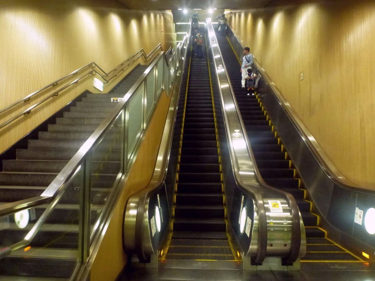 an escalator leading down to the exit area