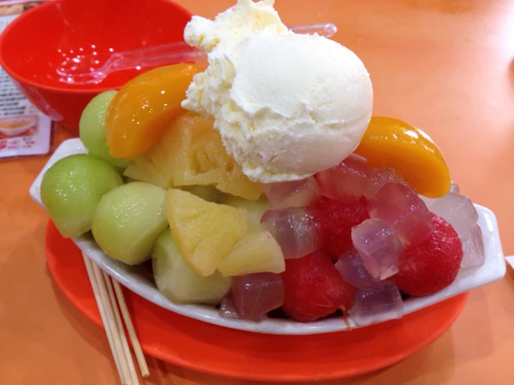 fruit with ice cream is in the bowl
