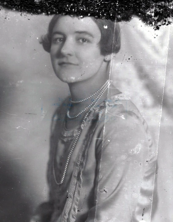 a woman with black hair is posing for a picture