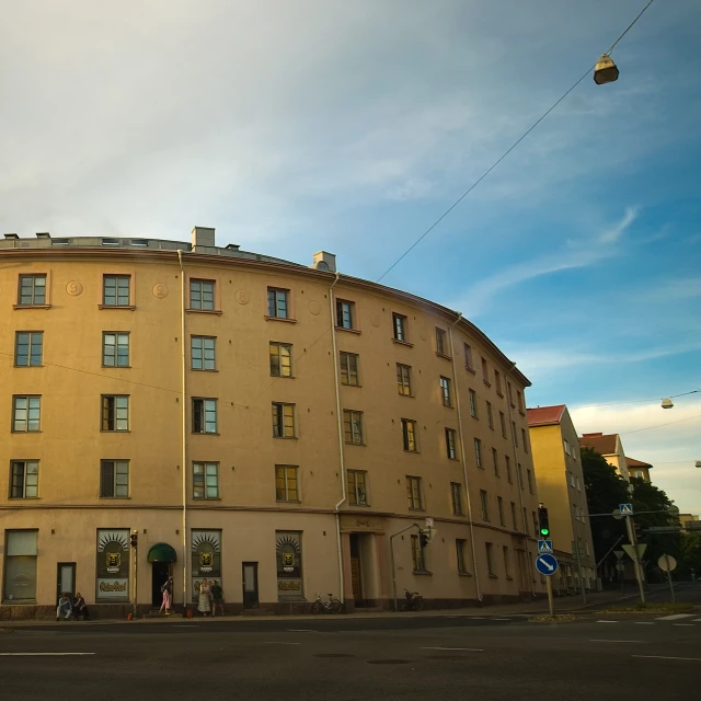 an old building with an air traffic light on the corner