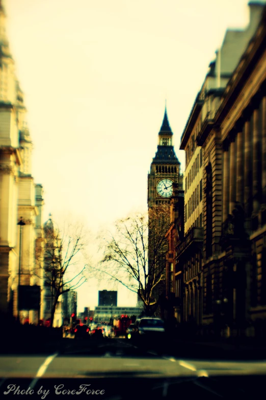 a street in a european city with a clock tower