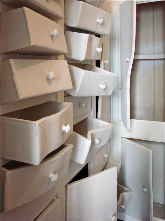 storage drawers are stacked up against the wall