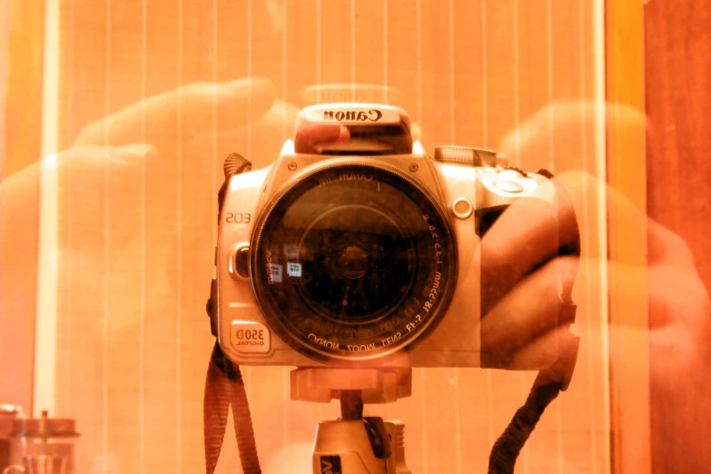 a person taking a picture through the glass with their camera