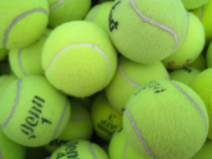 many tennis balls are arranged close together