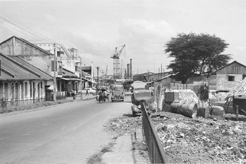 a vintage po of an industrial town with construction materials and equipment