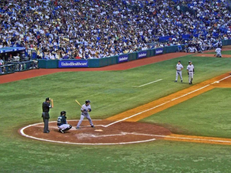 a baseball player standing at home plate ready to bat