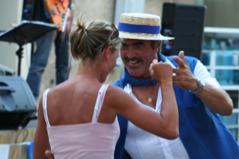 the man and woman is dressed in costume and hats