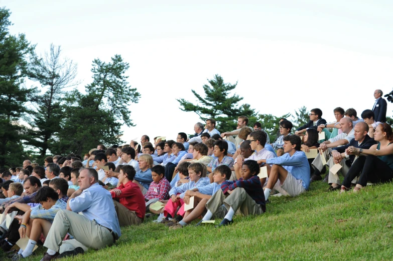 a man speaking to a crowd of people