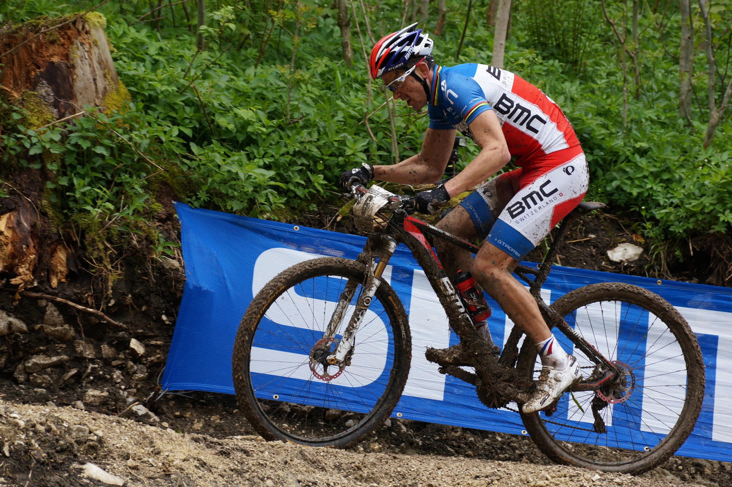 the man is riding his bike across the dirt track