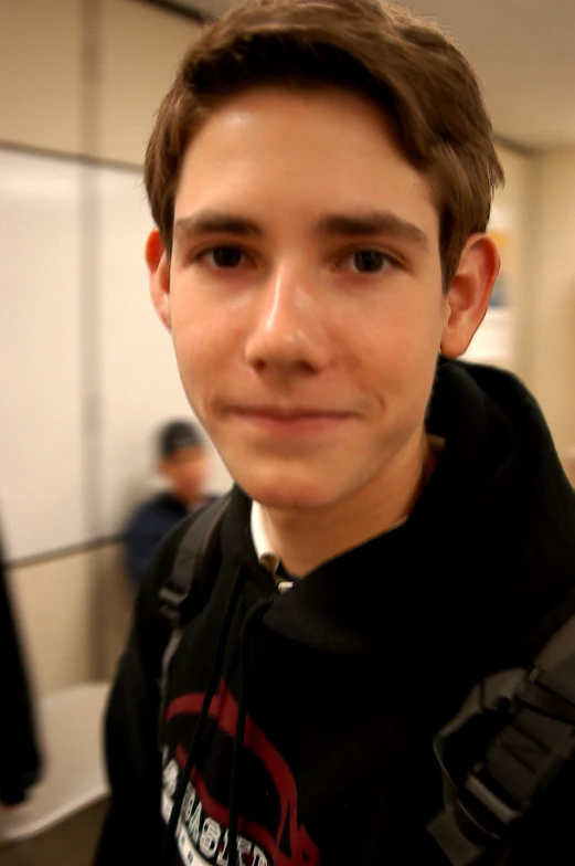 a young man taking a selfie with his camera