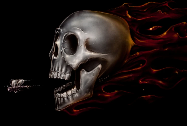 a close up of a skull on fire with a spider on it