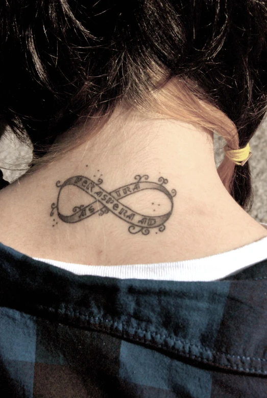 an image of a female with a tattoo of an old ribbon