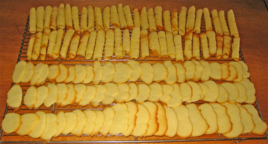 the bread sticks are lined and ready to be grilled