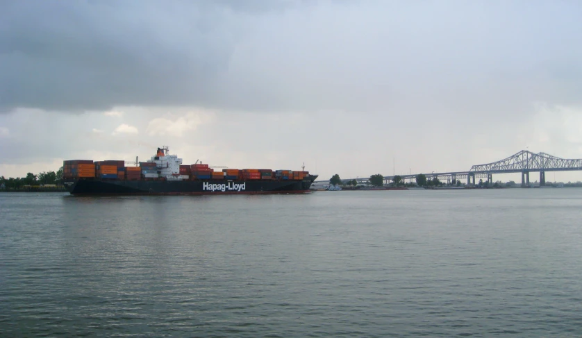 a large cargo ship traveling down the river