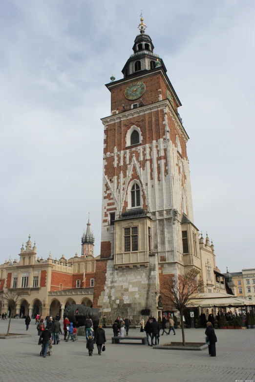 there is a tall building with a clock tower in the middle of it