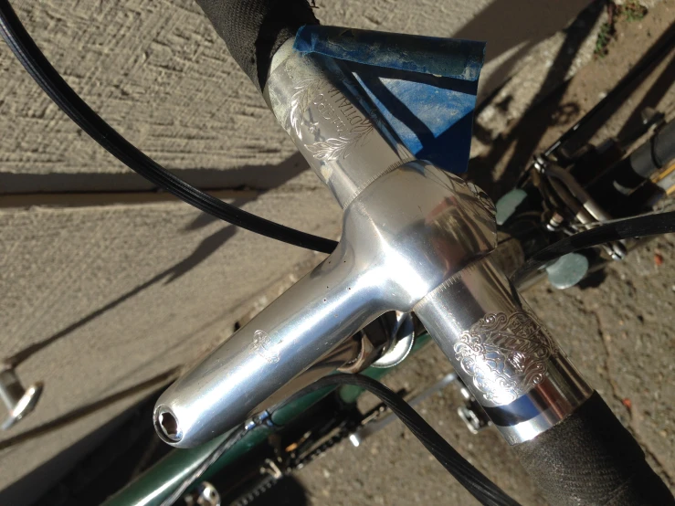 a view of a bicycle handlebar and seatpost