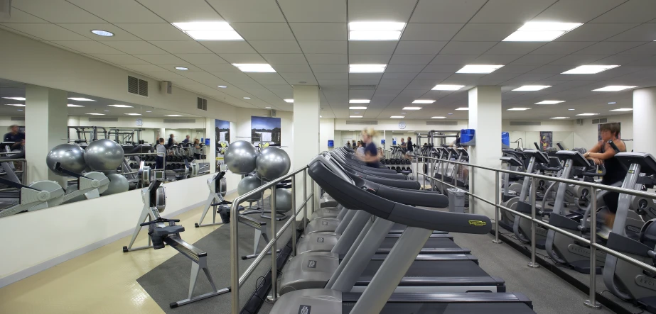 a man using treadmills in a gym