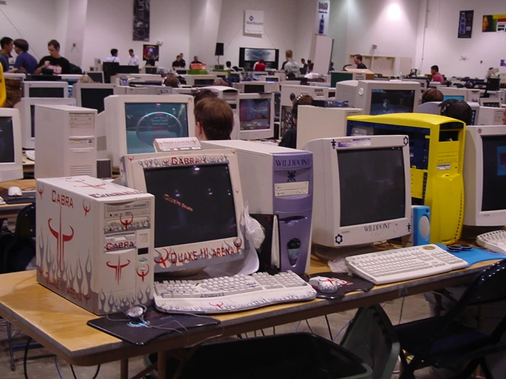 the desk in this room has many computer equipment on it