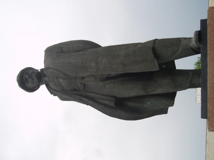 a man statue looks upward in the air