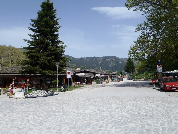 the main street in a mountain village near townhouses