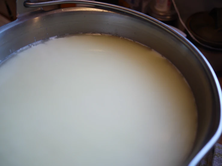 a pan of white liquid on top of a table