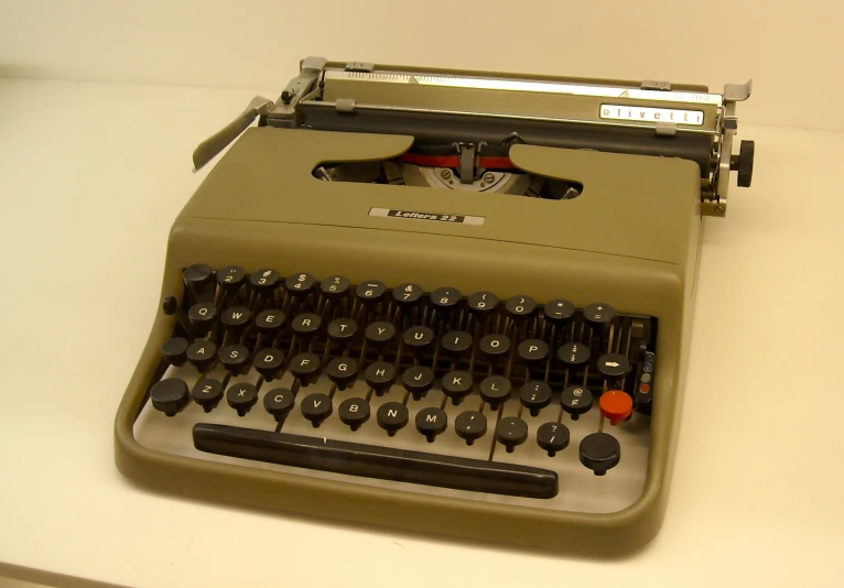 an old typewriter sitting on a table