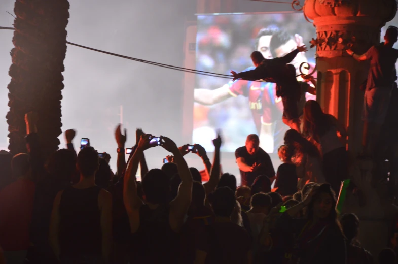 people are watching soing, as someone is on the ceiling