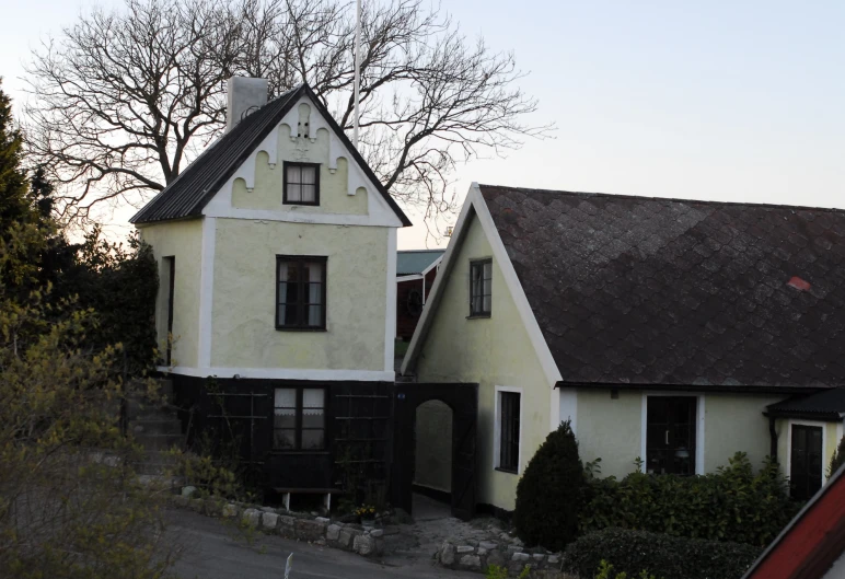 two identical houses are standing near each other