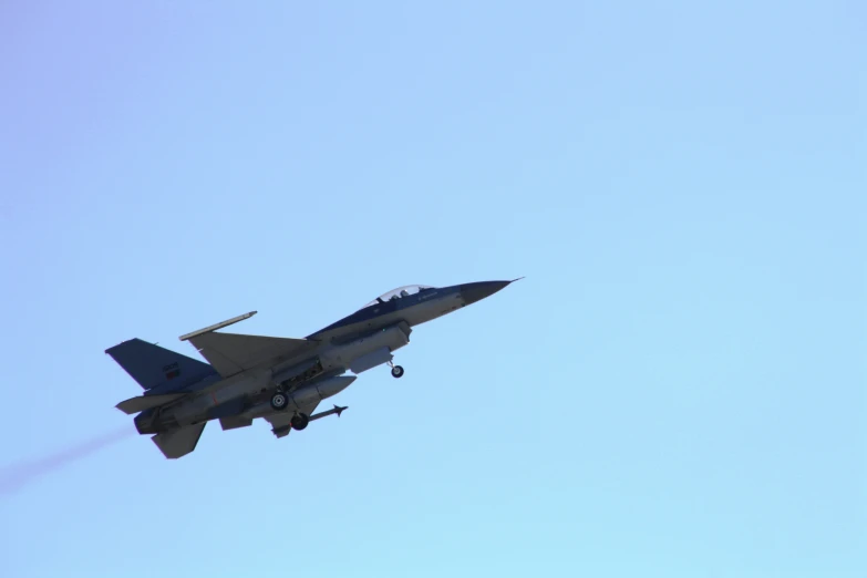 the jet plane is flying in the sky on an air show