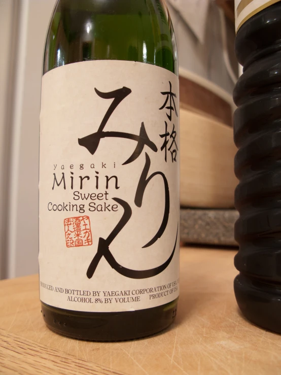 a bottle of wine next to an oriental style object